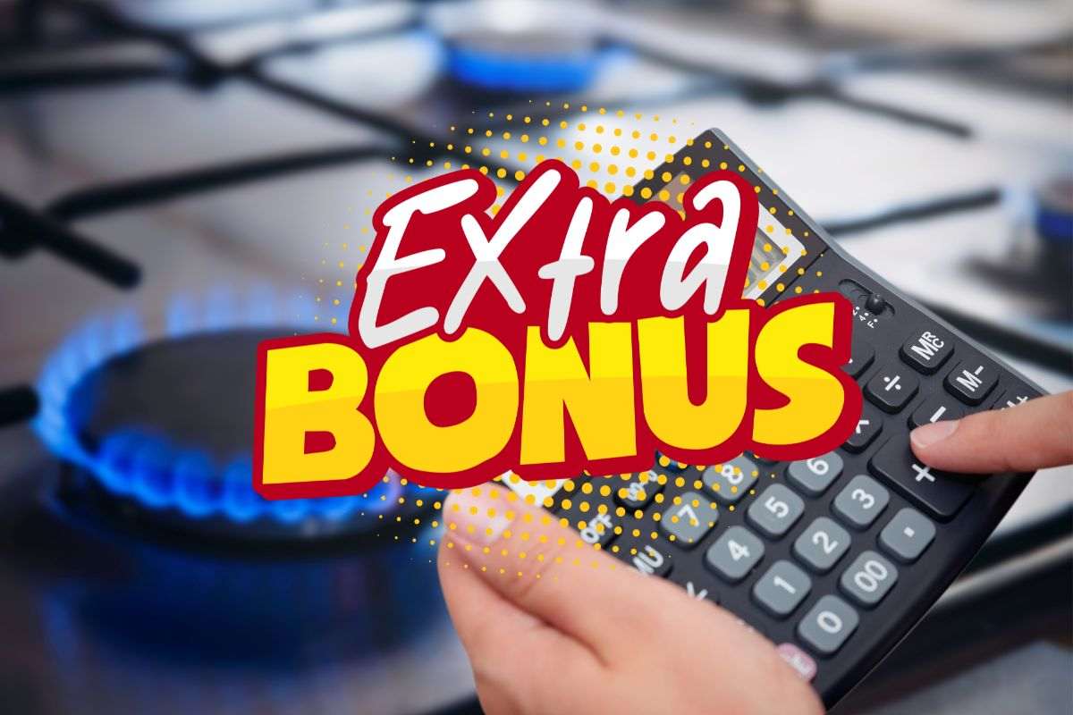 cucina a gas, calcolatrice e scritta extra bonus in primo piano