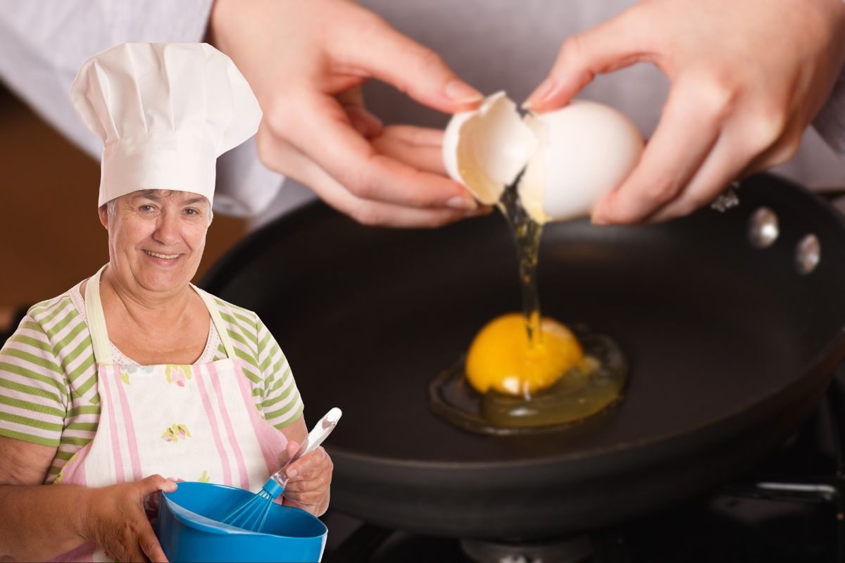 donna anziana che cucina e uova in padella